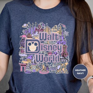 a woman wearing a disney world t - shirt