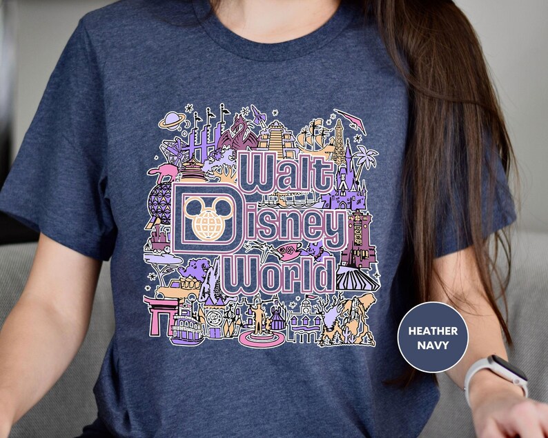 a woman wearing a disney world t - shirt
