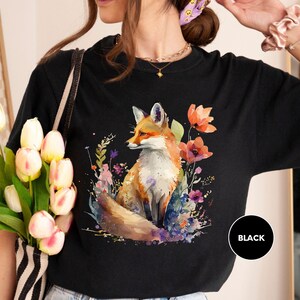 a woman wearing a t - shirt with a fox on it