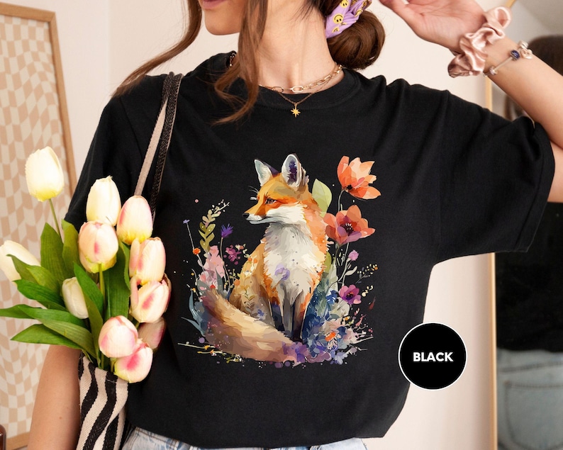 a woman wearing a t - shirt with a fox on it