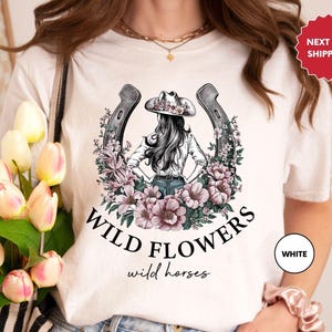 a woman wearing a t - shirt that says wild flowers