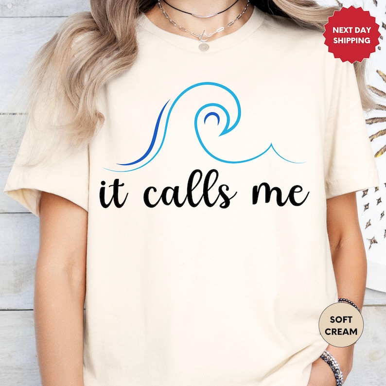 a woman wearing a t - shirt that says it calls me