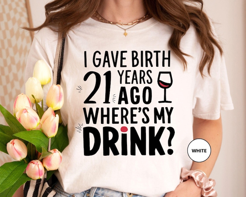 a woman wearing a t - shirt that says, i gave birth years 21 ago