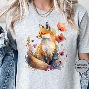a woman wearing a t - shirt with a fox on it
