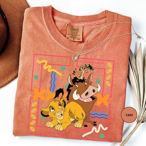 a t - shirt with a picture of a lion and a cow on it
