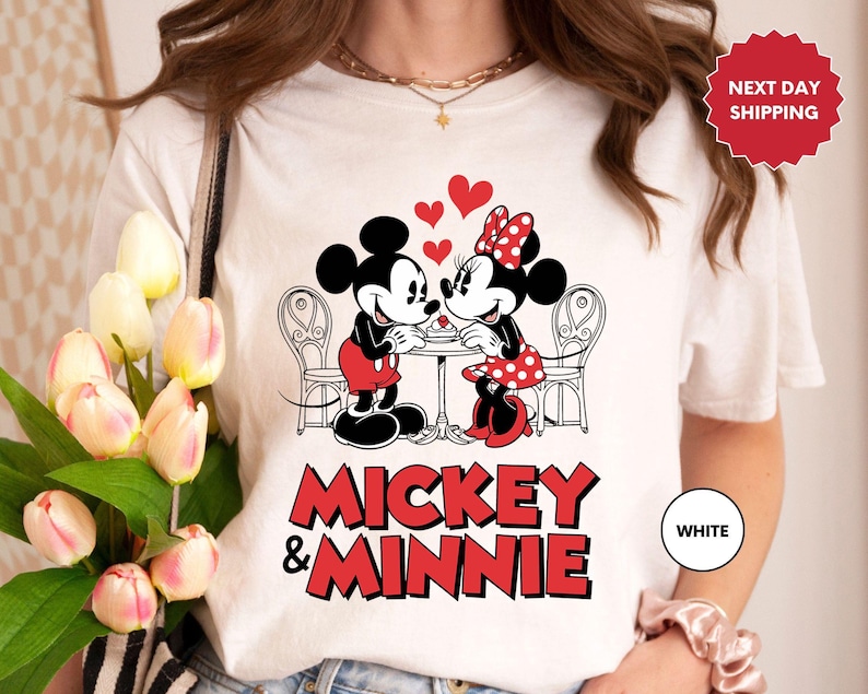 a woman wearing a mickey and minnie shirt