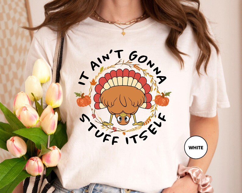a woman wearing a t - shirt with a turkey on it