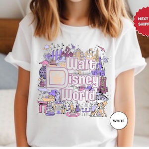 a young girl wearing a disney world tshirt