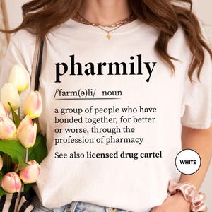 a woman holding a bouquet of flowers wearing a t - shirt that says pharm