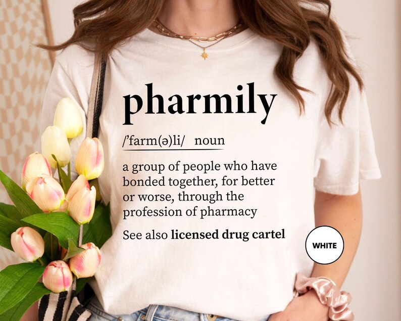 a woman holding a bouquet of flowers wearing a t - shirt that says pharm