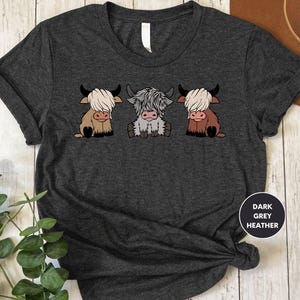 a t - shirt with three cows on it