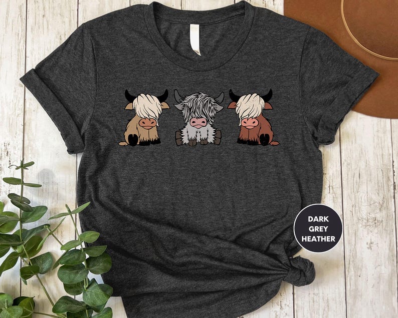 a t - shirt with three cows on it