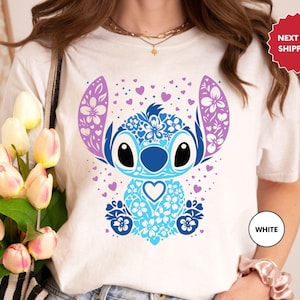 a woman wearing a t - shirt with a stitch stitch stitch stitch stitch stitch stitch