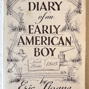 May include: A vintage book cover titled "Diary of an Early American Boy" by Eric Sloane. The cover features a pen and ink illustration of a rustic scene with a split-rail fence, tools, and the name "Noah Blake 1805".