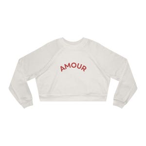 May include: White cropped sweatshirt with a red "AMOUR" graphic on the front.