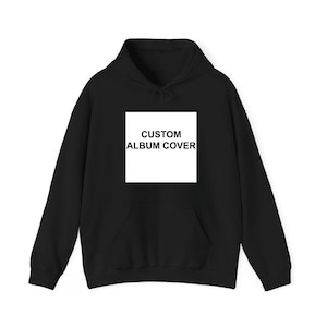 A black hoodie with a white square on the front that says "CUSTOM ALBUM COVER".