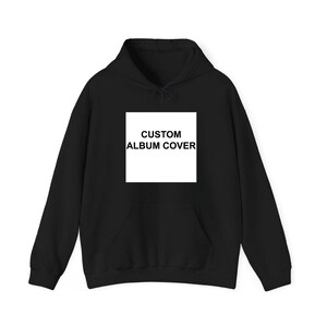 A black hoodie with a white square on the front that says "CUSTOM ALBUM COVER".