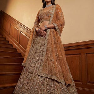 May include: A set of three ceramic mugs with a speckled, matte finish. The mugs are in shades of cream, light gray, and dark gray. Each mug has a simple, minimalist design and a rounded handle.