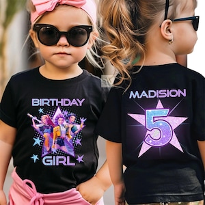 May include: Black t-shirt with a colorful graphic of three cartoon girls and the words "BIRTHDAY GIRL". The back of the shirt has the name "MADISION" and the number "5" inside a star.