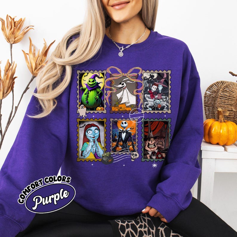 May include: Purple Comfort Colors sweatshirt featuring a collage of characters from The Nightmare Before Christmas, designed as postage stamps. The sweatshirt has the text "Comfort Colors Purple" in a circular design.