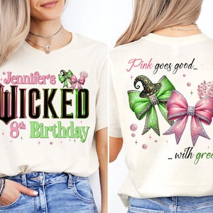 May include: Cream-colored t-shirt with the text "Jennifer's Wicked 8th Birthday" in black, green, and pink. The front features a witch hat and bow graphic. The back of the shirt says "Pink goes good... with green" with bow and crown graphics.