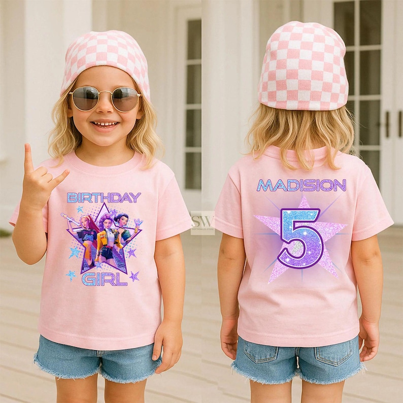 May include: A pink t-shirt with the words "BIRTHDAY GIRL" and a graphic of three cartoon characters. The back of the shirt has the name "MADISION" and the number "5" in a star design. The child is wearing a pink and white checkered beanie and sunglasses.