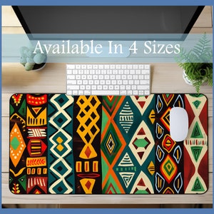 May include: A colorful geometric patterned mousepad with a black background. The pattern features a variety of shapes and colors, including red, yellow, green, blue, and white. The mousepad is available in four sizes.