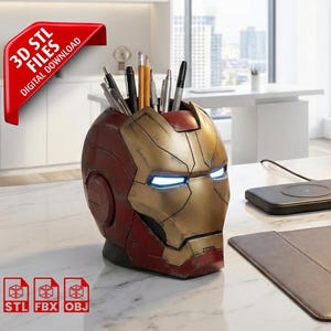 May include: A desk organizer shaped like Iron Man's helmet, in red and gold. The eyes glow blue. The organizer holds pens and pencils. The image includes the text "3D STL FILES DIGITAL DOWNLOAD" and icons for STL, FBX, and OBJ files.