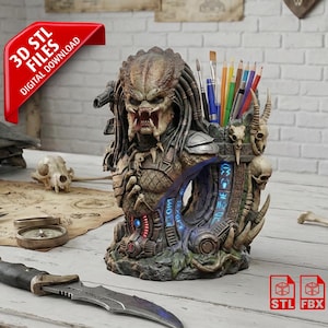 May include: A detailed Predator-themed pen holder with a menacing face, holding pens and pencils. The design includes skulls and alien script. The image also shows a knife, compass, and a red banner that says "3D STL FILES DIGITAL DOWNLOAD".