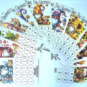 May include: A set of seasonal gnome cards. Each card displays a unique gnome design with corresponding months and numbers. The cards are white with colourful illustrations and the text "Save The Gnomes".