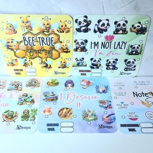 May include: A selection of colourful sticker sheets with diverse designs and text. The sheets feature illustrations of bees, pandas, sloths, and other graphics. Text includes "Bee True Yourself", "I'm Not Lazy I'm Zen", "Take It Slow", "I Deserve It", and "Note to Self".