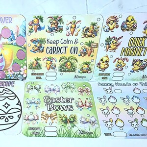 May include: A set of Easter-themed game cards with illustrations of bunnies, chicks, carrots, and eggs. Text includes "Egg Hunt Saver", "Keep Calm & Carrot On", "Chick Magnet", "Kale-Egg-Scope", "Easter Bows", and "Bunny Heads or Tails". The cards are brightly colored.