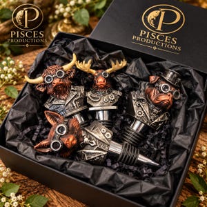 May include: A set of four bottle stoppers in a black gift box labelled Pisces Productions. The stoppers feature steampunk-style animal heads including a highland cow, a moose, a bulldog, and a fox, all wearing goggles and metallic gear-adorned clothing.