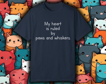 May include: A navy blue t-shirt with white text that reads "My heart is ruled by paws and whiskers."