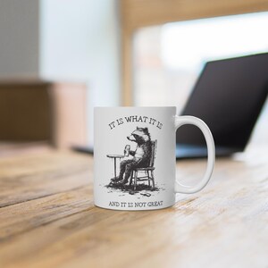 It Is What It Is And It Is Not Great Mug, Dark Humor Mug, Gift For Friend & Coworker, Funny Sarcastic Gift, Grim humor Gift, Racoon Meme, image 3