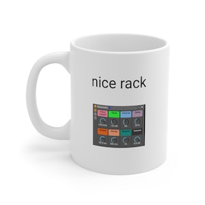 May include: White ceramic mug with a black text that says "nice rack" and a graphic of a digital audio workstation interface with knobs and sliders.