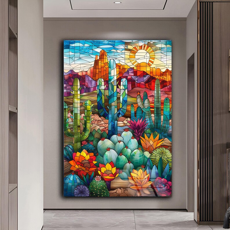 May include: A stained glass style artwork depicting a desert landscape with cacti and succulents in shades of green, blue, red, yellow, and orange. The sun is shining in the background.