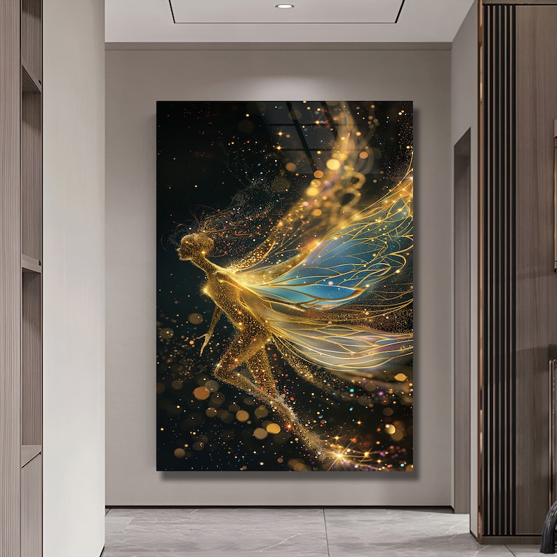 May include: A golden fairy with blue and gold wings flies against a black background with sparkling gold glitter.