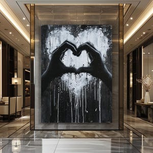 May include: Black and white abstract painting of two hands forming a heart shape. The background is black with white paint splatters and drips.