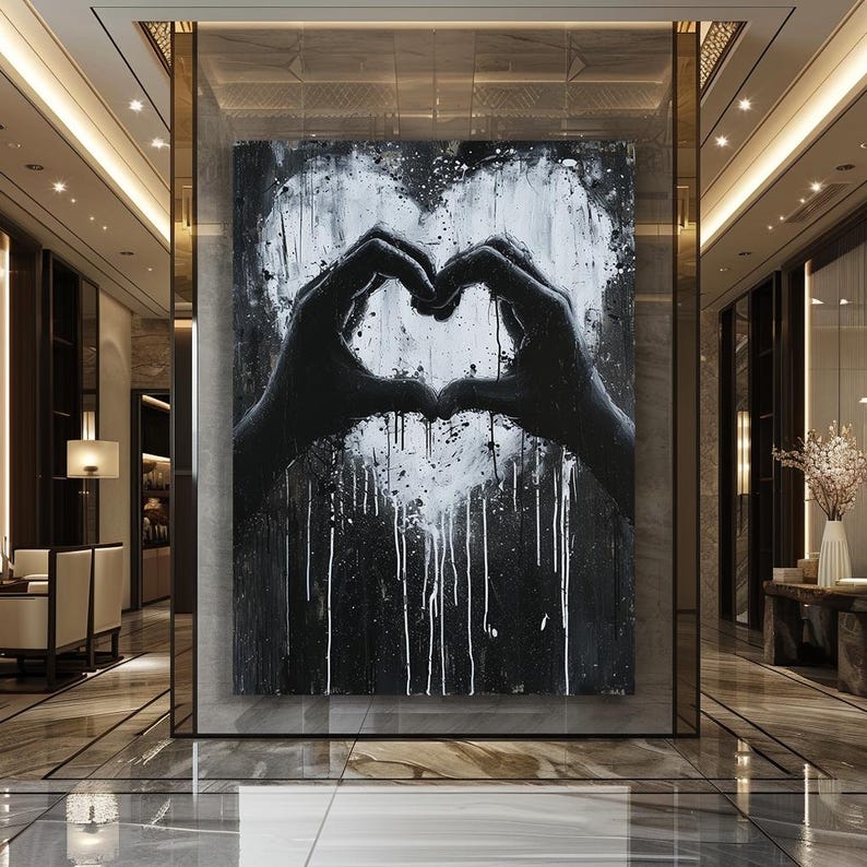 May include: Black and white abstract painting of two hands forming a heart shape. The background is black with white paint splatters and drips.