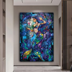 May include: A stained glass style illustration of a mermaid with long blue hair and a colorful tail. The mermaid is surrounded by a blue and purple background with a stained glass effect.