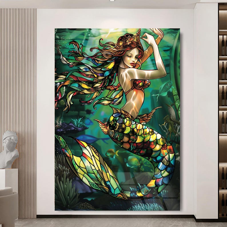 May include: A colourful stained glass style illustration of a mermaid with long flowing hair and a tail with scales. The mermaid is surrounded by green seaweed and fish.