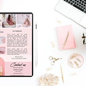 May include: A pink and white digital tablet displaying a website with a pink background. The website features a woman's headshot, text about previous collaborations, and a mission statement. The text reads "Previous Collaborations", "My Mission", and "Contact us".