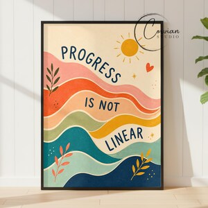 May include: A rectangular wall art print featuring wavy horizontal bands in shades of pink, orange, yellow, green, and blue. The text PROGRESS IS NOT LINEAR is printed in dark blue. A yellow sun, a small red heart, and leaf illustrations appear.