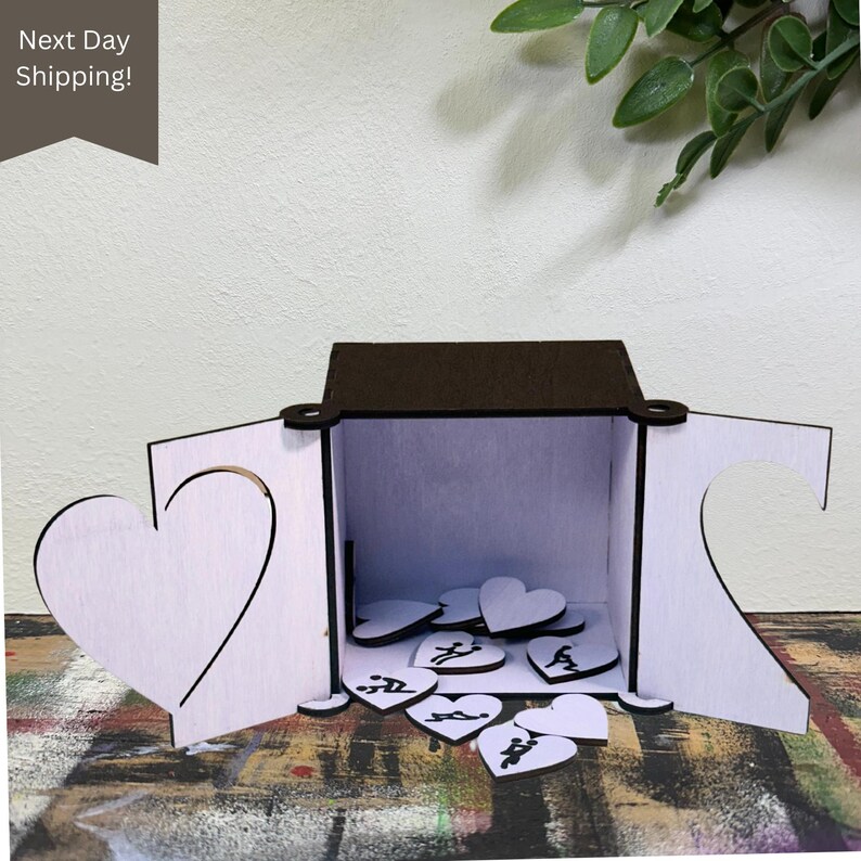 Ignite connection and spice things up with this handmade wooden Love Token box! Includes heart-shaped tokens featuring flirty, fun, and intimate prompts. The laser-cut box opens to reveal a stash of spicy surprises—perfect for wedding gifts, anniversaries, Valentine’s Day, or just because. Ships next day!