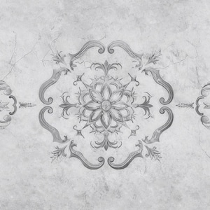 May include: Monochrome floral design on a textured, light gray background. The central motif is a stylized flower surrounded by ornate, symmetrical scrollwork and leaf accents. The design is reminiscent of vintage tile patterns.