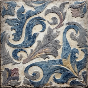 May include: Square, textured tile with a repeating pattern of stylized leaves and floral elements. The design features shades of blue, gray, and a touch of gold against a neutral background. The tile has a weathered appearance.