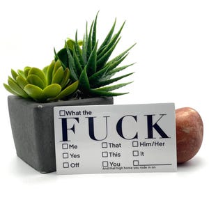 May include: A trio of ceramic mugs with a speckled, matte finish in cream, light grey, and dark grey. Each mug features a minimalist design and a rounded handle.