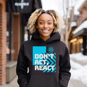 May include: Black hoodie with a blue and white graphic that says "Don't Act, React" and a small atom symbol.