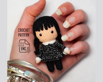 May include: Crochet pattern for a black and white doll with black hair and a white collar. The pattern is available in PDF format and is in English. The text "CROCHET PATTERN" and "PDF ENG" is visible in the image.